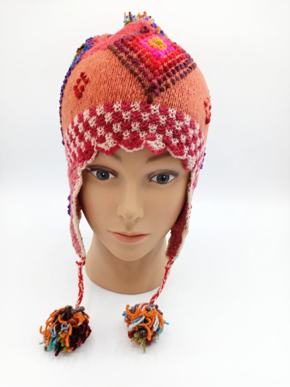 Hand-knitted Andean sheep's wool chullo winter hat with geometric patterns